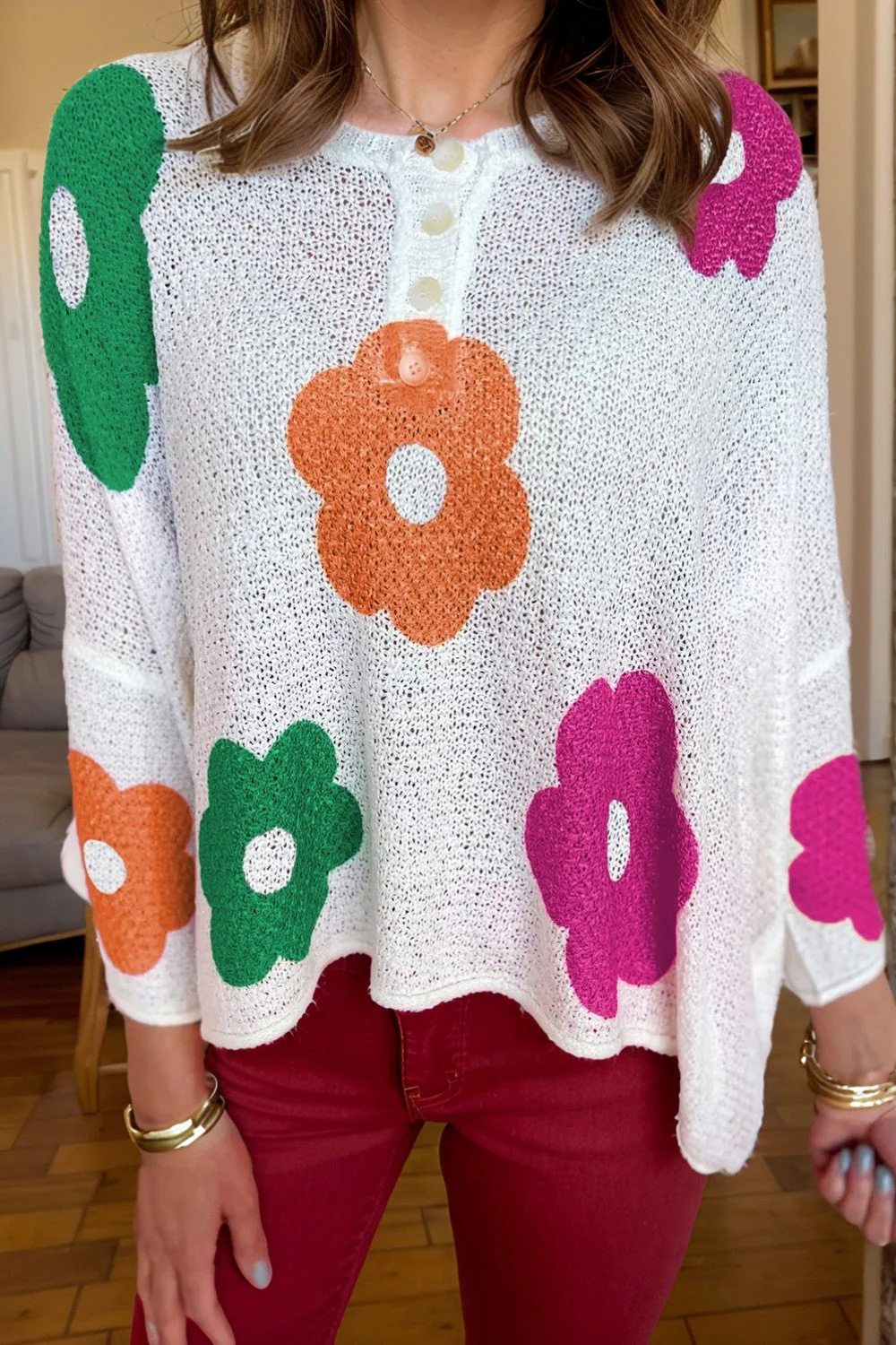 Delia | Floral knit top with a crew neck and quarter buttons